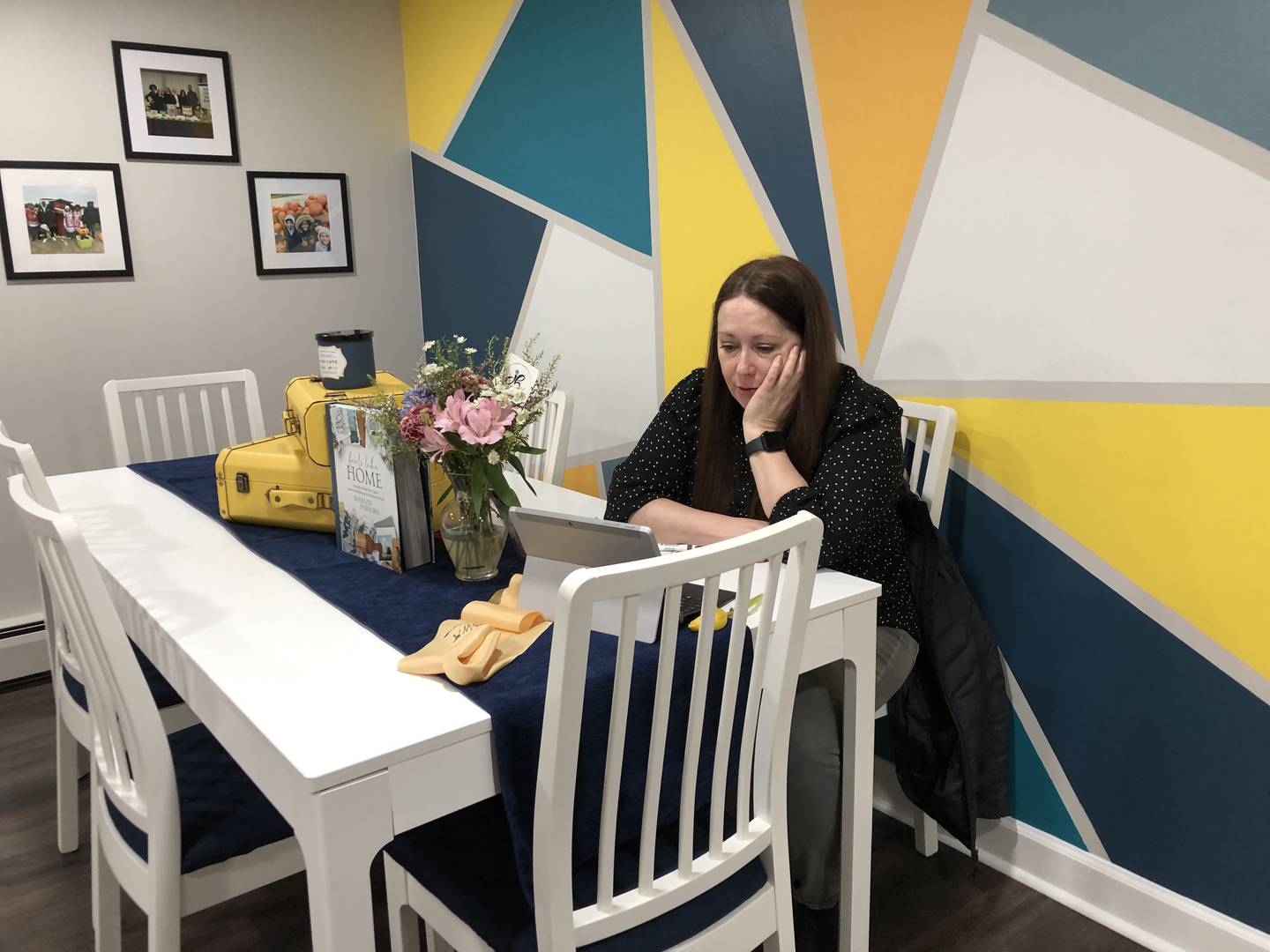 Jennifer Beltrame, of Bremer Team – Keller Williams Success Realty in McHenry, takes a video conference call on Monday, March 25, 2024, in the office's new concierge suite. The space allows clients a place to work and bring pets and family when showings force them from their homes.