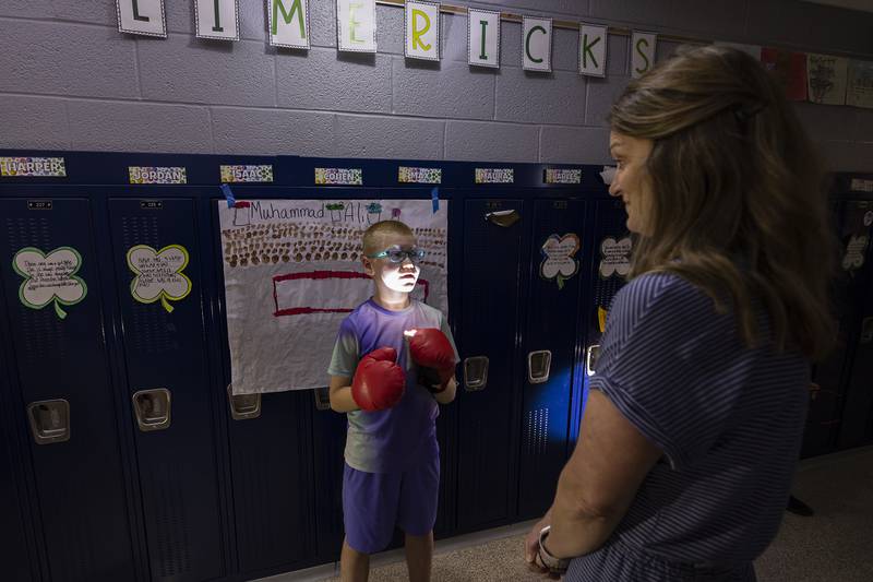 Washington School third-grader Finn Engles recites information about his wax museum figure Muhammad Ali to teacher Tera McClain Thursday, May 16, 2024.