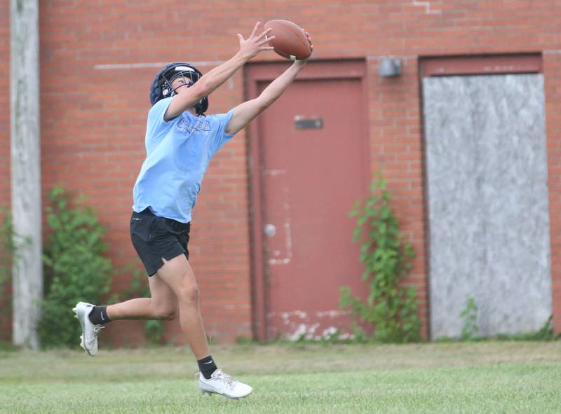 Bureau Valley's Kai Walowski leaps in the air to make a catch during the first day of football practice on Monday, Aug. 12, 2024 at Ken Bourquin Field in Manlius.