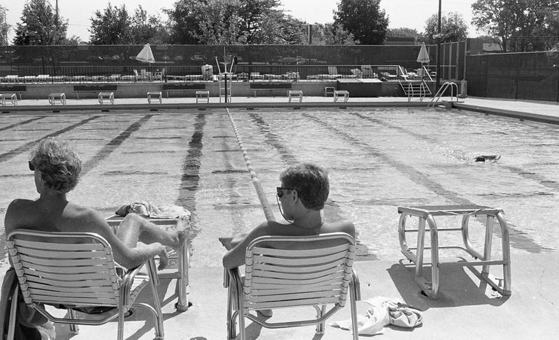 At Hopkins Park Pool in DeKalb, sparse crowds signal the end of the swimming season, Labor Day weekend August 1986.