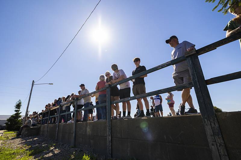 Spectators line a parking lot in Rock Falls on Monday, June 10, 2024, awaiting the Sick the Magazine burn-out competition.