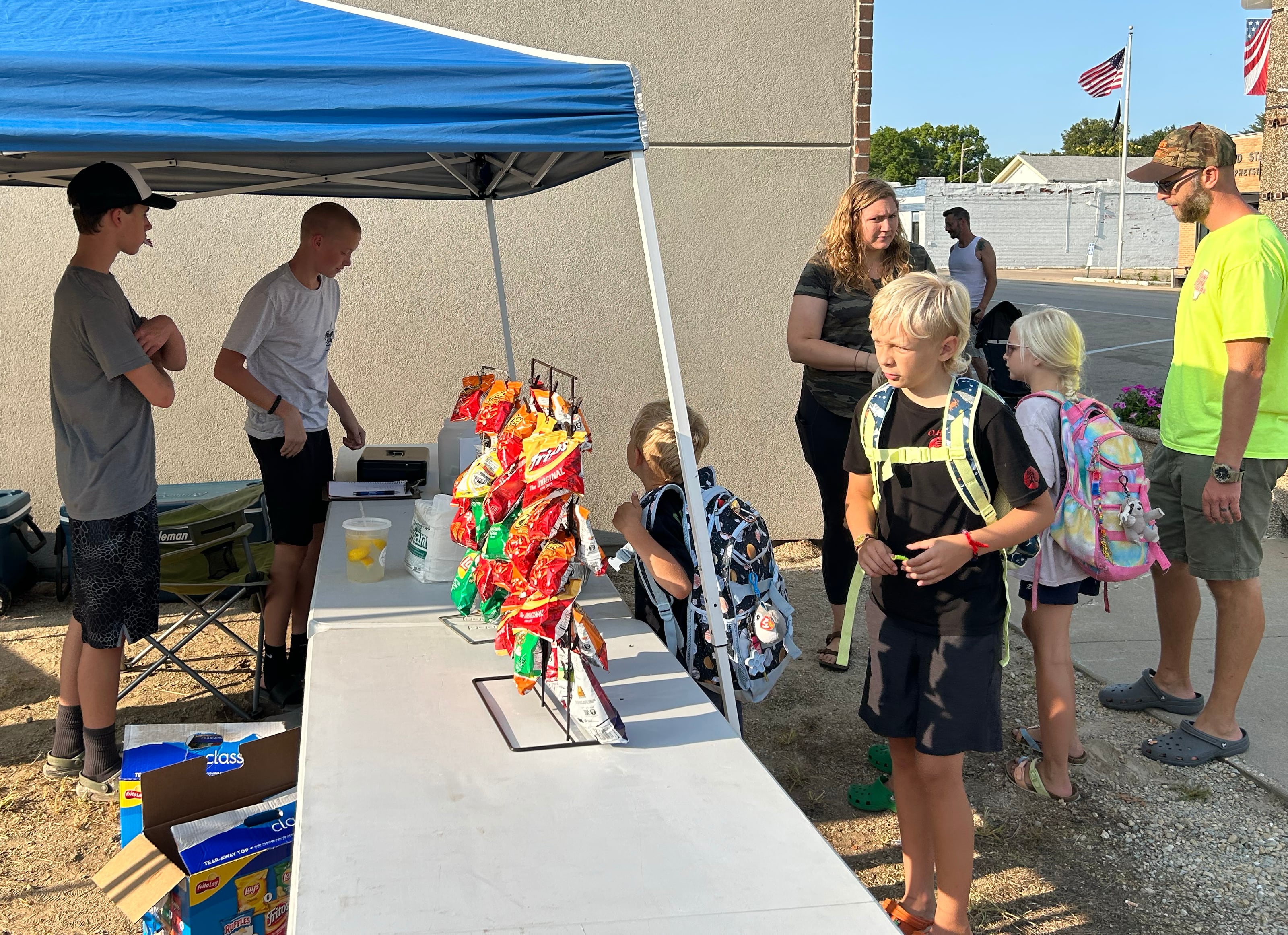 Boy Scout Troop 94 has a food booth at Prophetstown's Fourth Friday on Friday, July 26, 2024. The VanderMolan family of Morrison stopped by during the event. Pictured are Judah, Hannah, Isaiah, and Elijah and their mom and dad, Craig and Jennifer.