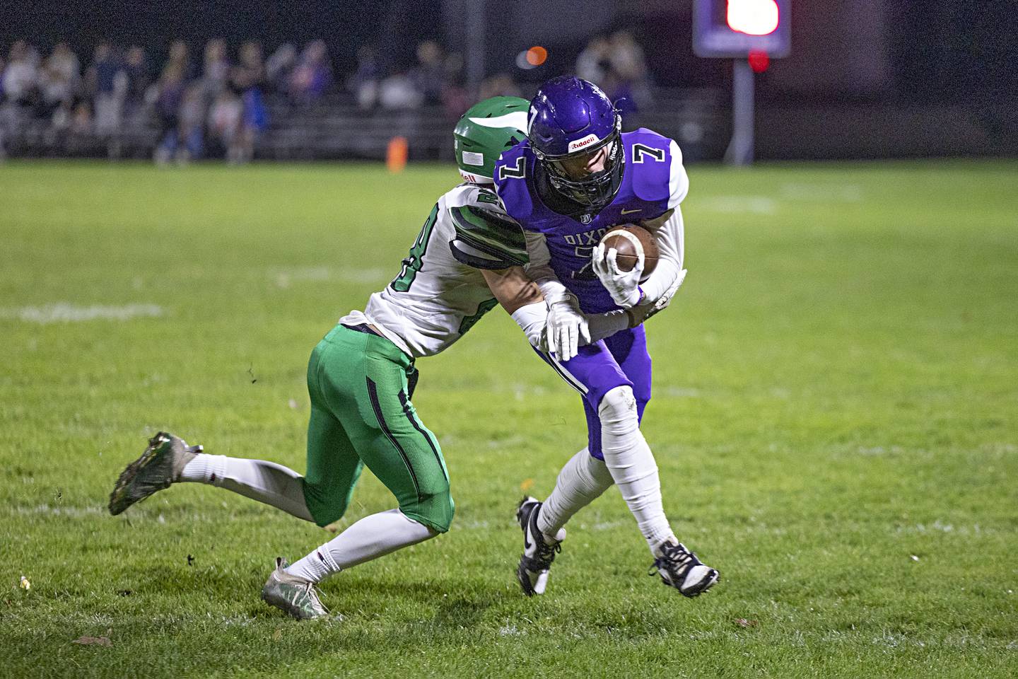 Dixon’s Cort Jacobson fights for yards against North Boone Friday, Oct. 20, 2023 in Dixon.