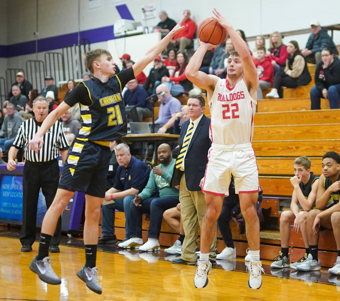 Streator's Christian Benning (22) shoots a three pointer against Yorkville Christian's Jordan Purvis (21) during the 60th annual Plano Christmas Basketball Tournament Plano High School on Wednesday, Dec 27, 2023.