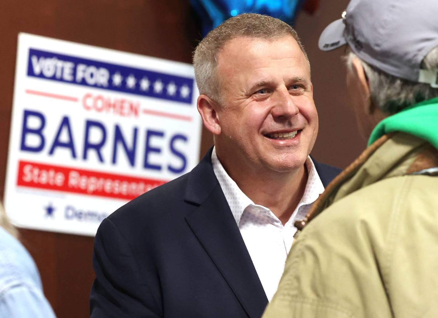 Cohen Barnes, DeKalb mayor and candidate for the democratic nomination for the 76th district seat in the Illinois House of Representatives, talks to supporters Tuesday, March 19, 2024, during his election night party at Faranda’s in DeKalb.