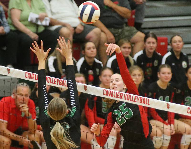 L-P's Addison Urbanski sends a kill past Geneseo's Kendall Ellerbrock in the Class 3A Regional on Tuesday, Oct. 24, 2023 at Sellett Gymnasium.