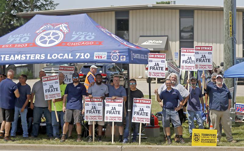 Drivers and dock workers, represented by Teamsters Local 710, picket outside JA Frate's Crystal Lake headquarters on Thursday, June 13, 2024. The unionized drivers are striking after negotiations over a new contract broke down.