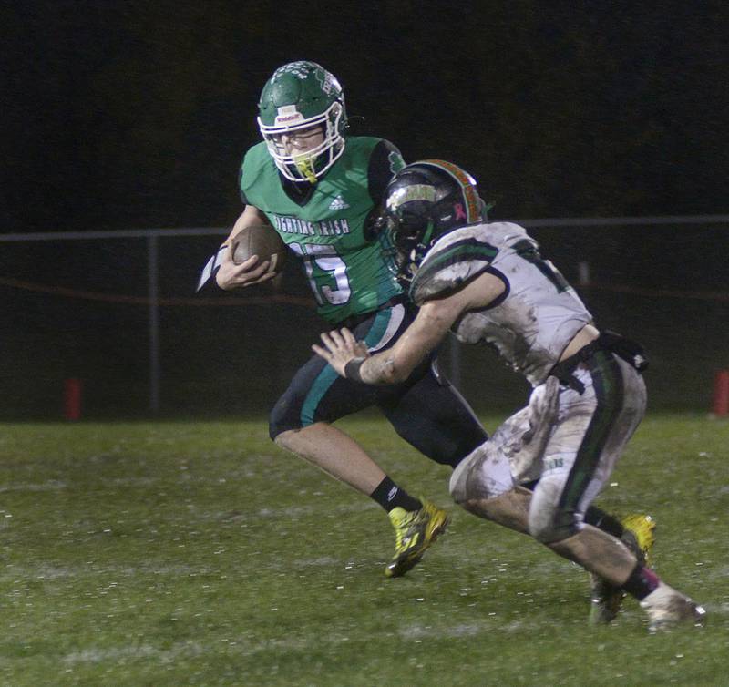 Seneca quarterback Paxton Giertz looks to get past Dwight’s Dylan Crouch on a keeper in a 2023 game at Seneca.