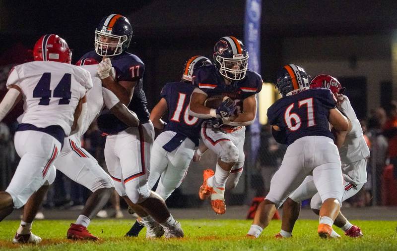 Oswego’s Noah Vera (26) carries the ball against West Aurora during a football game at Oswego High School on Friday, Sept. 29, 2023.