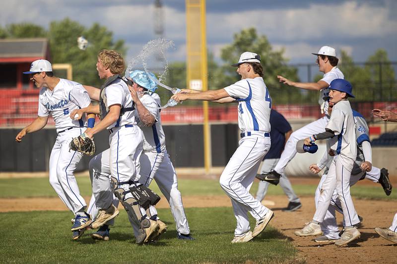 The Newman Comets baseball team celebrate their win over Chicago Hope Monday, May 27, 2024 during the Class 2A super-sectional in Rockford to advance to the state tournament.