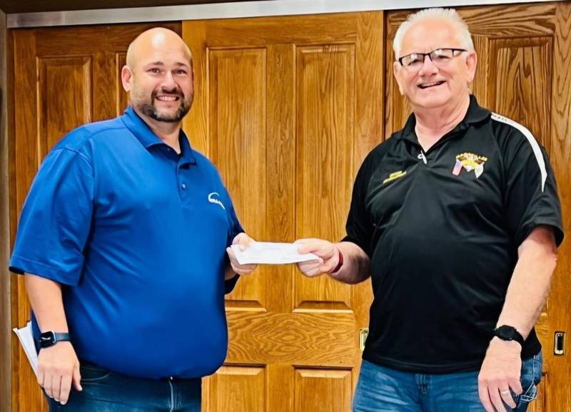 Infra-Metals representative Ryan Nelle (left) recently presented to Marseilles Mayor Jim Hollenbeck a check for $10,000 toward the city's Broadway Park improvement project.