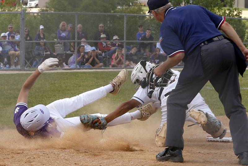 McHenry's A.J. Chavera tags out Hampshire's Charles Wiggins at home plate during a Class 4A Hampshire sectional baseball game on Wednesday, May 29, 2024, at the Hampshire High School.