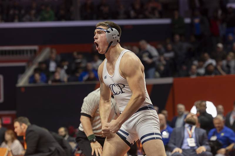 IC Catholic’s Michael Calcagno celebrates his win over Rochelle’s Kaiden Morris in the 2A 215 pound championship match Saturday, Feb. 17, 2024 at the IHSA state wrestling finals at the State Farm Center in Champaign.