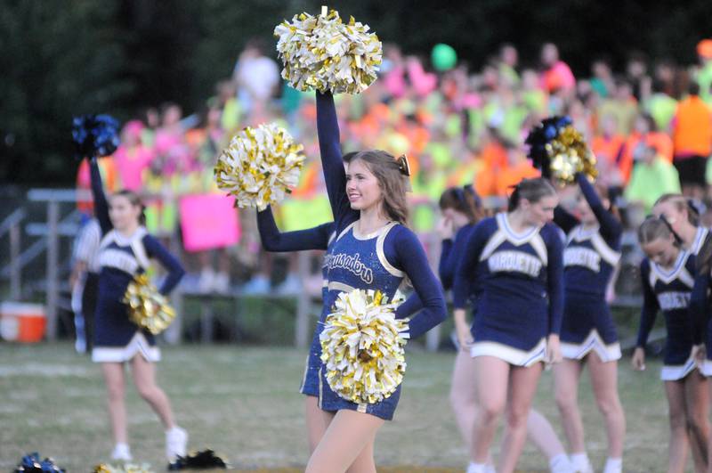 Marquette cheerleaders and poms perform before the matchup against Seneca at Gould Stadium on Friday, Sept. 13, 2024.