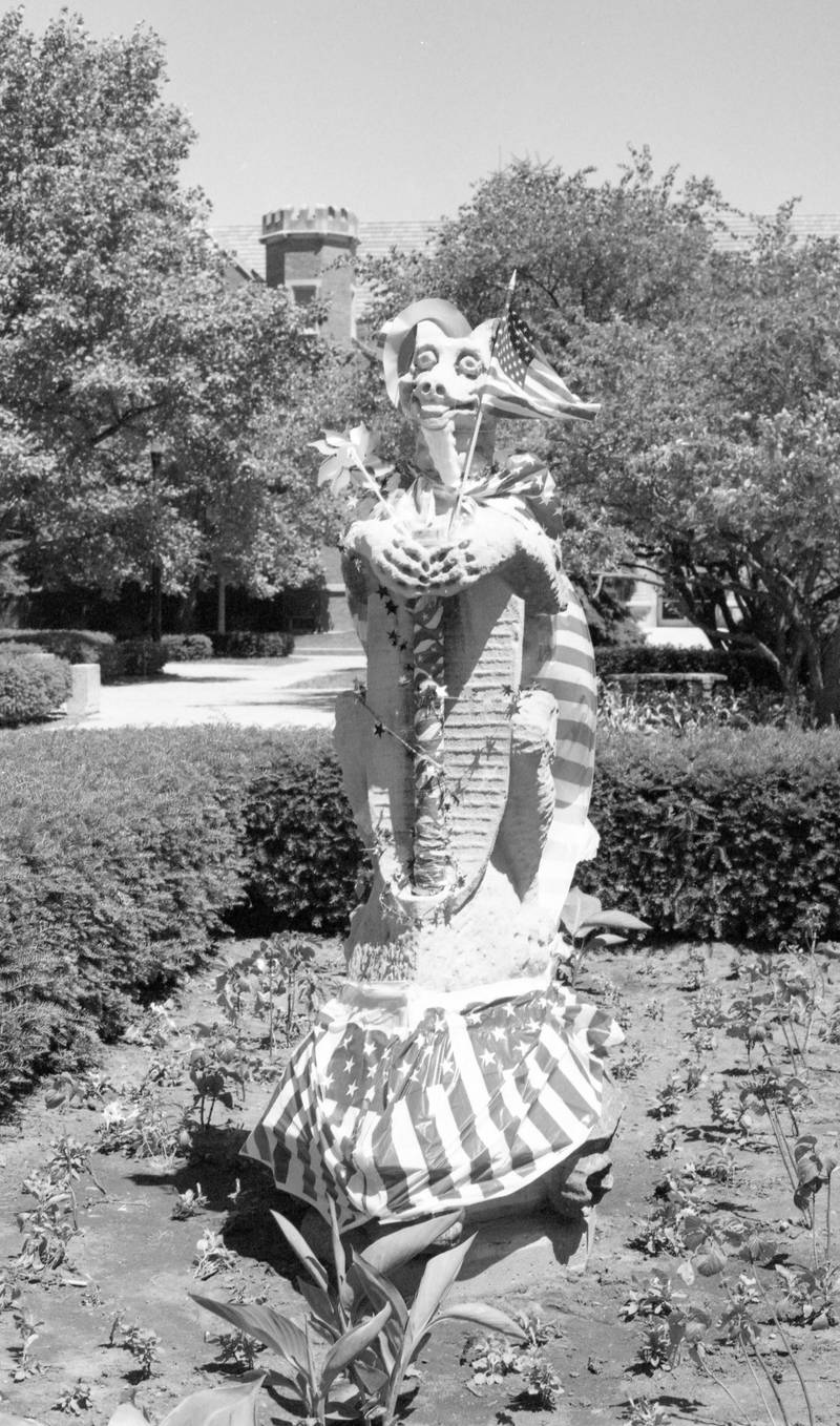 The gargoyle, near Altgeld Hall on the campus of Northern Illinois University, decorated for the celebration of Independence Day, July 1997.