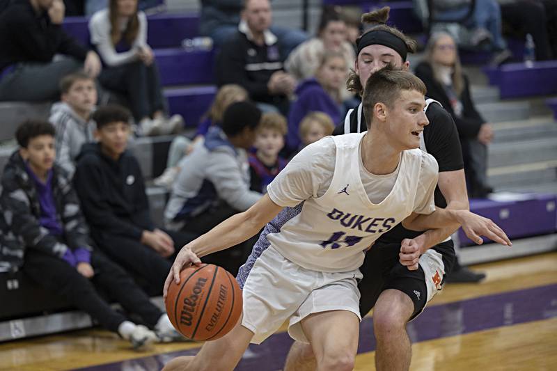 Dixon’s Cullen Shaner drives the lane against Kewanee’s Blaise Lewis Tuesday, Nov. 28, 2023 in Dixon.