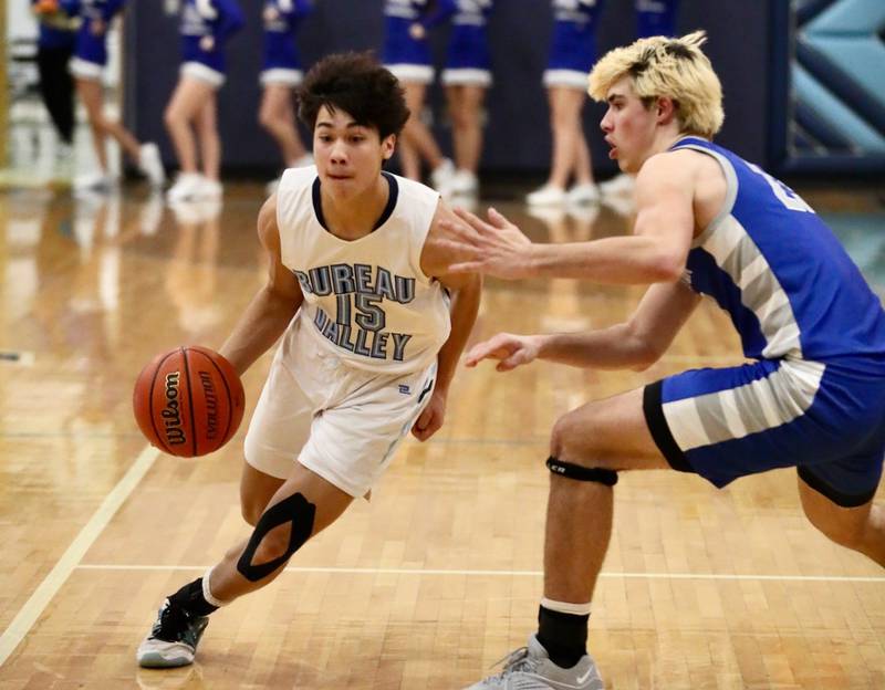 Bureau Valley's Corban Chhim drives on Princeton's Noah LaPorte at the Storm Cellar Thursday night. The Storm won 62-56.