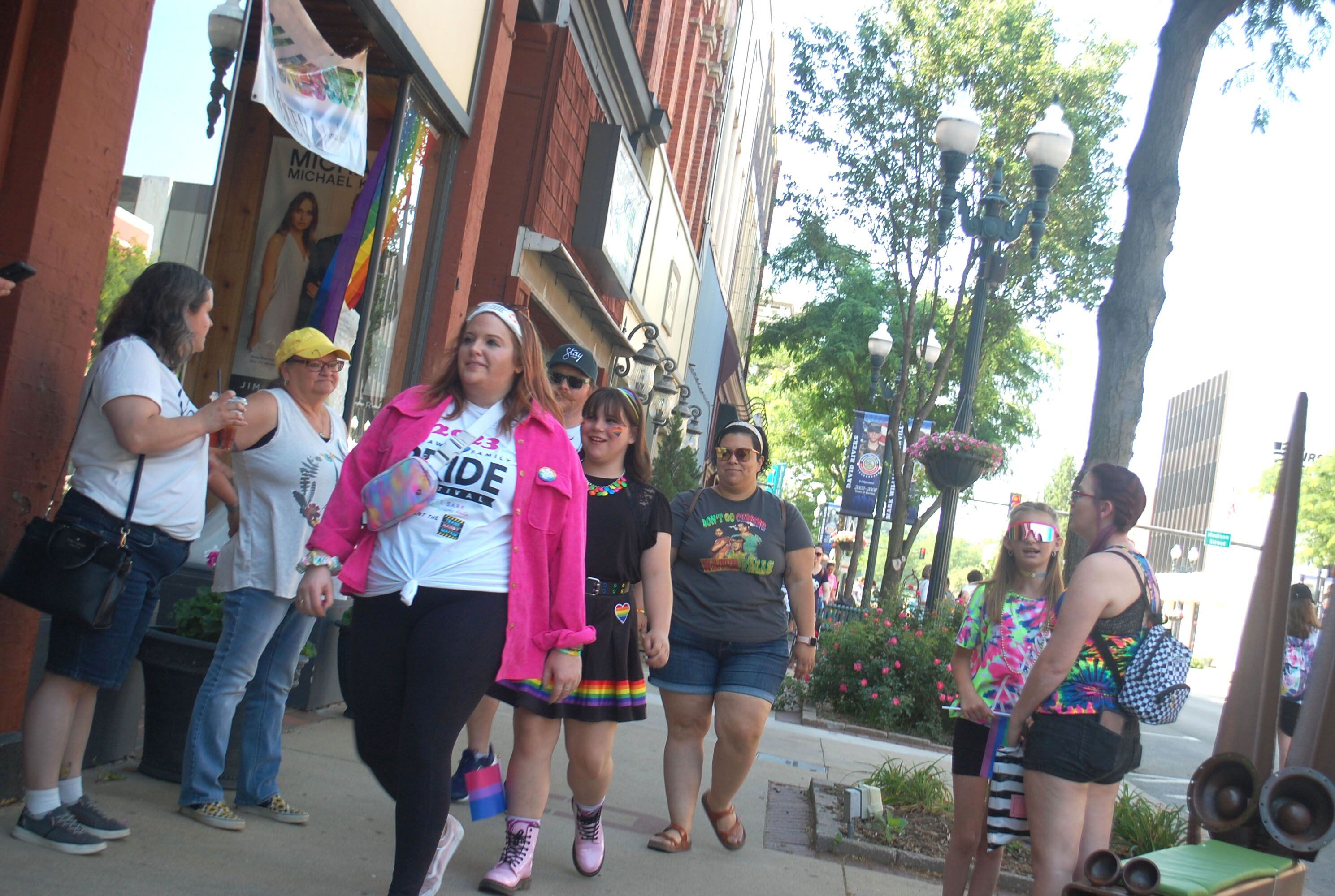 Ottawa Family Pride Festival visitors stroll the La Salle Street sidewalk in downtown Ottawa after the parade Saturday, June 10, 2023.