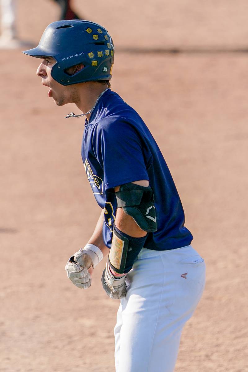 Neuqua Valley's Andrew Gould (8) reacts after reaching base on a bunt against Yorkville during a Class 4A Neuqua Valley Regional semifinal baseball game at Neuqua Valley High School in Naperville on Thursday, May 23, 2024.