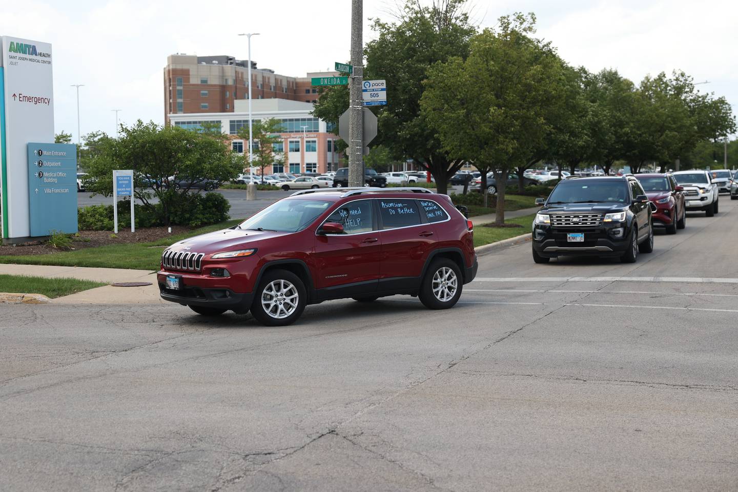 Nurses drive around St. Joseph Hospital during a rally to bring awareness regarding ongoing negotiations at in Joliet on Tuesday July 11th, 2023.