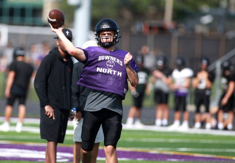 Downers Grove North quarterback Owen Lansu throws the ball during a practice on Tuesday, Aug. 20, 2024 at the school.