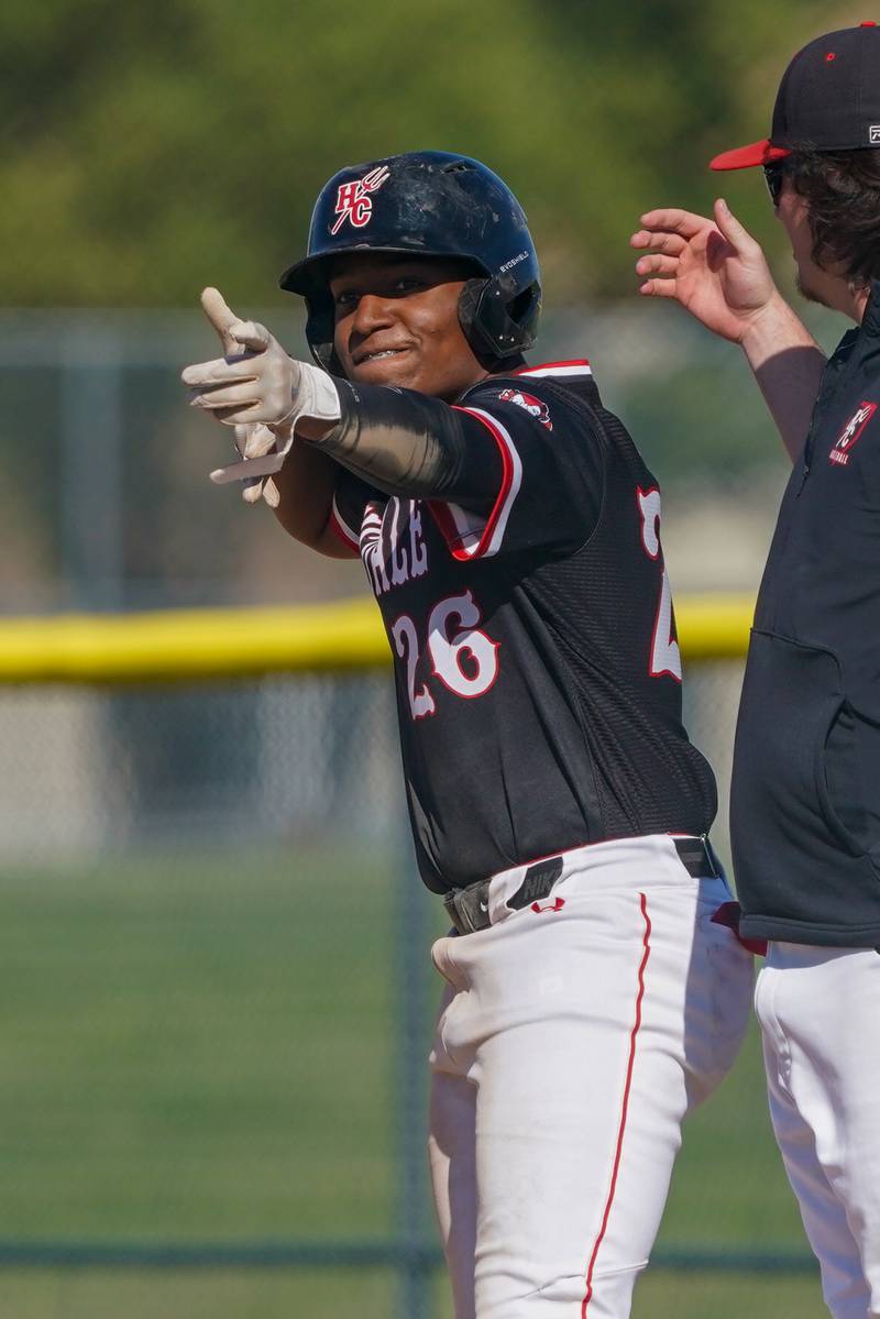 Hinsdale Central's Brayan Hernandez (26) celebrates after hitting a double against Oswego during a Class 4A Waubonsie Valley Regional semifinal baseball game at Waubonsie Valley High School in Aurora on Wednesday, May 22, 2024.