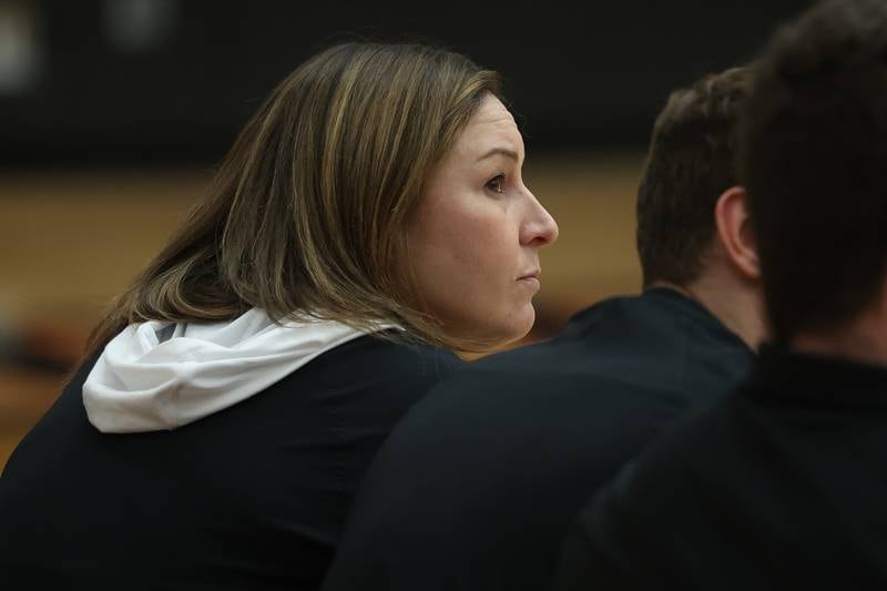 Lincoln-Way West head coach Jodi Frigo sits on the bench to watch the match against Providence on Wednesday, April 3, 2024 in New Lenox.