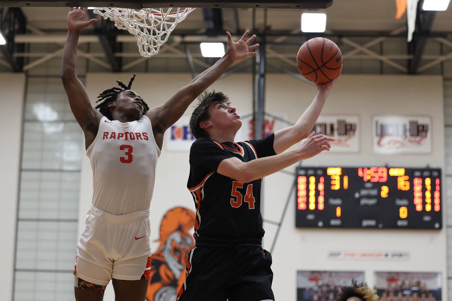 Lincoln-Way West’s Wyatt Carlson lays in a shot against Rich Township in the Class 4A Lincoln-Way West Regional semifinal on Wednesday, Feb. 21st 2024 in New Lenox.