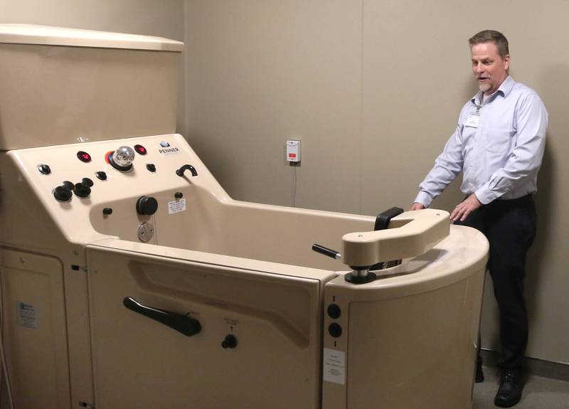 Bart Becker, administrator of the DeKalb County Rehabilitation and Nursing Center, shows off the large tub Wednesday, July 10, 2024, available to residents as he leads a tour of the centers new transitional care wing. The new addition recently opened and residents have begun moving in.