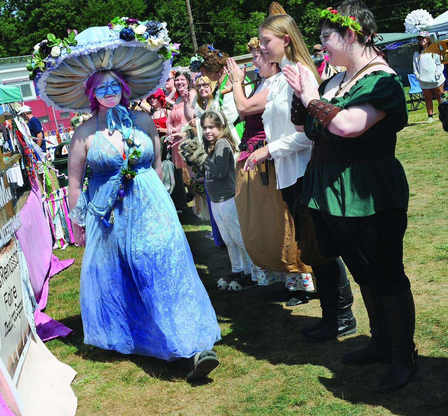 Participants in the costume contest show their attire during a judging contest Saturday during the annual Marseilles Renaissance Faire.