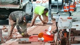 Photos: Sidewalk construction continues in downtown Genoa