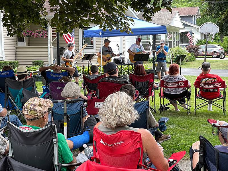 Well Strung plays a tune on the lawn of Phil and Ferol Labash during 2023 Porchfest. The band is back again this year.
