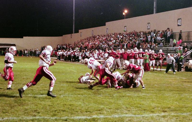 L-P and Ottawa play football in 1999. This was the 100th meeting between the two teams.