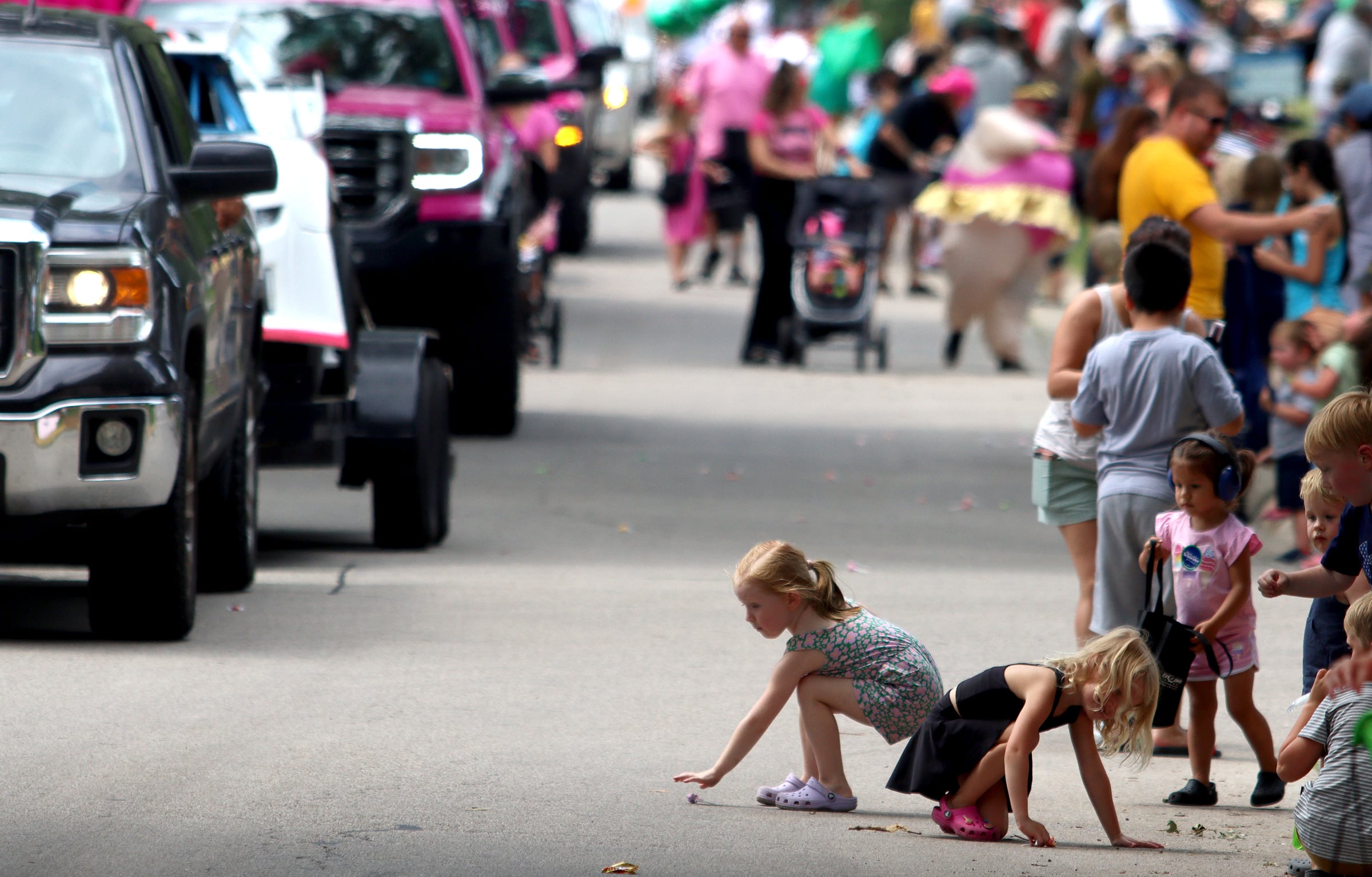 Children gather candy as part of the Fiesta Days parade along Main Street in McHenry Sunday.