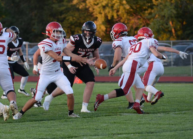 Hall quarterback Dylan Glynn tosses the ball to a running back during action against Erie-Prophetstown on Friday, Sept.6, 2024.