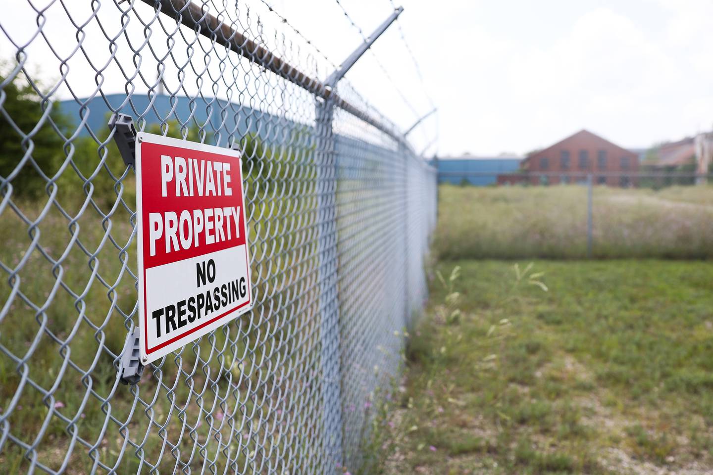 A No Trespassing sign is posted along the fence of the abandoned U.S. Steel Mill on Saturday July 13, 2024 in Joliet.