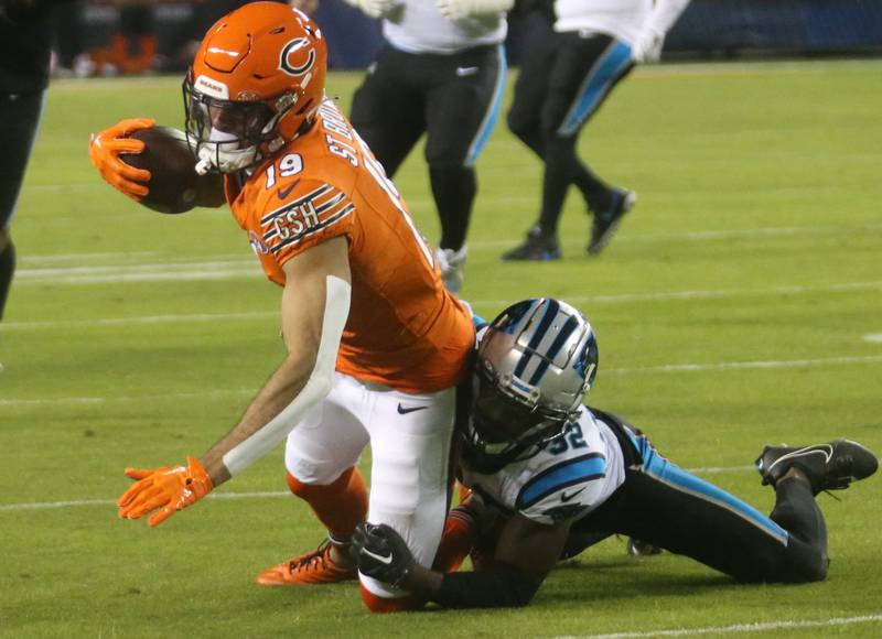 Chicago Bears wide receiver Equanimeous St. Brown is brought down by Carolina Panthers corner back Dicaprio Botle on Thursday, Nov. 9, 2023 at Soldier Field.