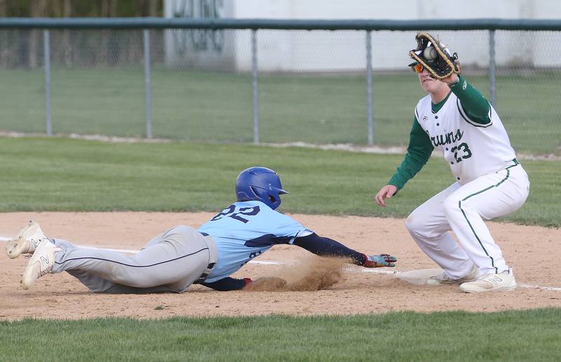 Bureau Valley's Elijah Endress slides back into first base as St. Bede's Luke Tunnell makes a catch on Monday, May 1, 2023 at St. Bede Academy.