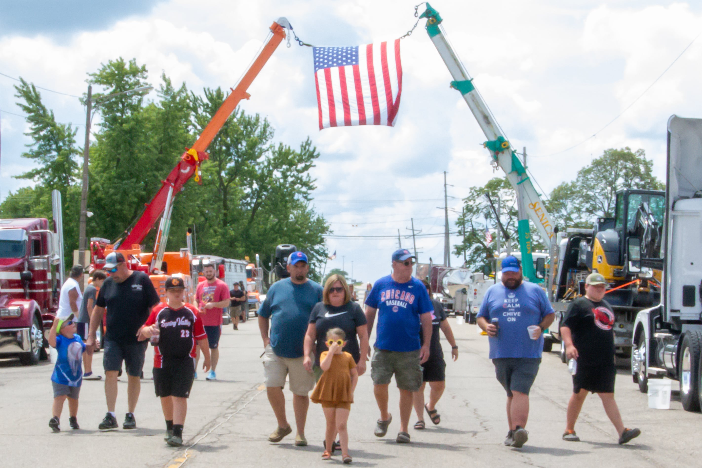 People walk through the Convoy Against Cancer Big Truck Show on Saturday, July 20, 2024 on Main Avenue in Ladd.