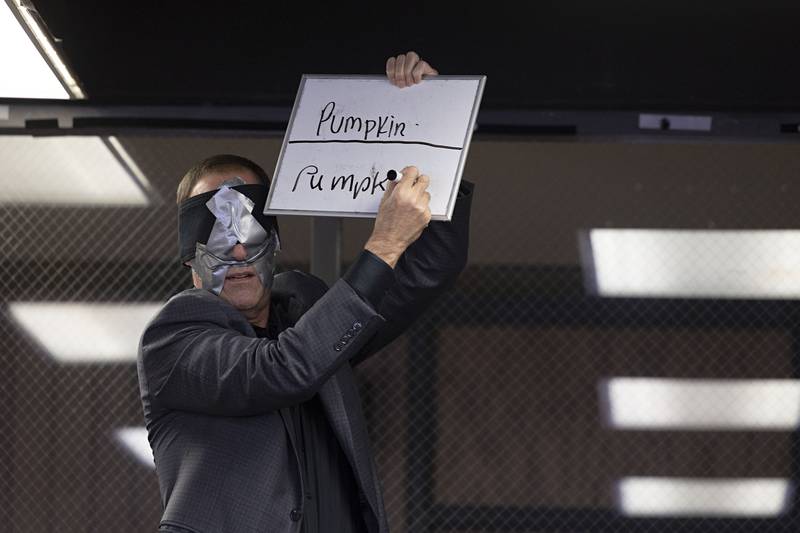 Christopher Carter correctly writes the the word hidden from him by a student during the Wednesday, Nov. 16, 2022 show at Sauk Valley Community College.