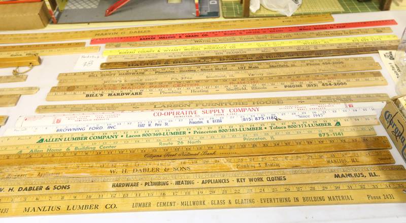 Vintage rulers with Bureau County businesses are on display during the Model Train Fair and Farm Toy Show on Saturday, Feb. 17, 2024 at the Bureau County Fairgrounds in Princeton.