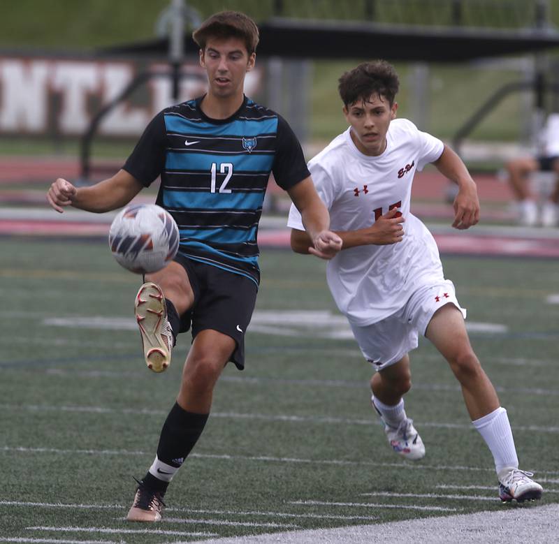 Woodstock North's Brody Case tries to control the ball in front of Rockford East's Rafael Esquer during a nonconference soccer match on Thursday, Sept. 5, 2024, at Huntley High School.