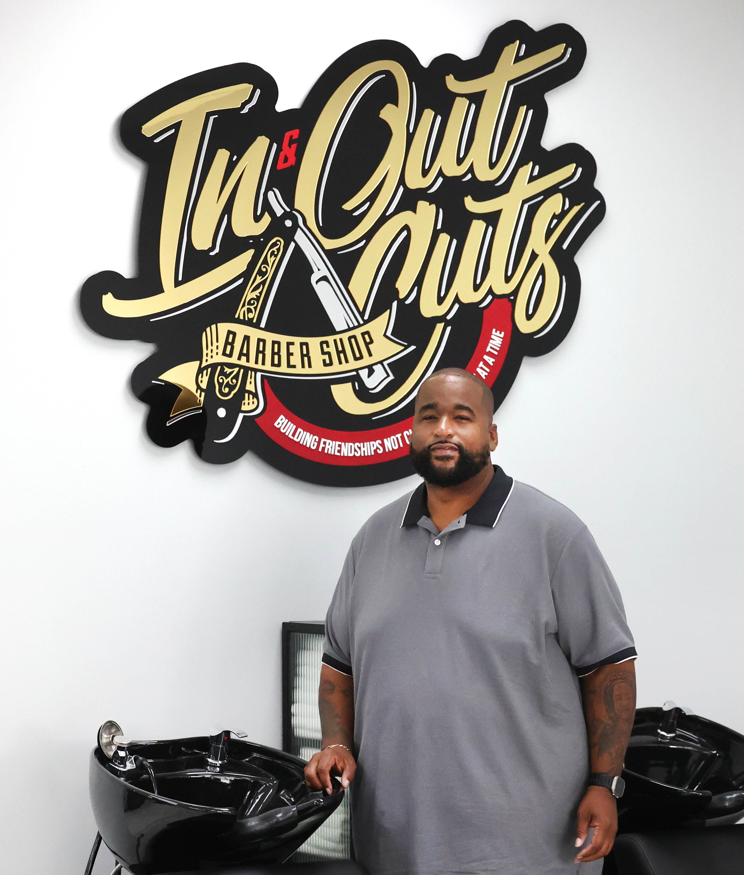 Andre Powell, owner of In & Out Cuts Barbershop, Friday, Aug 9, 2024, in his new location at 2331 Sycamore Road in DeKalb.