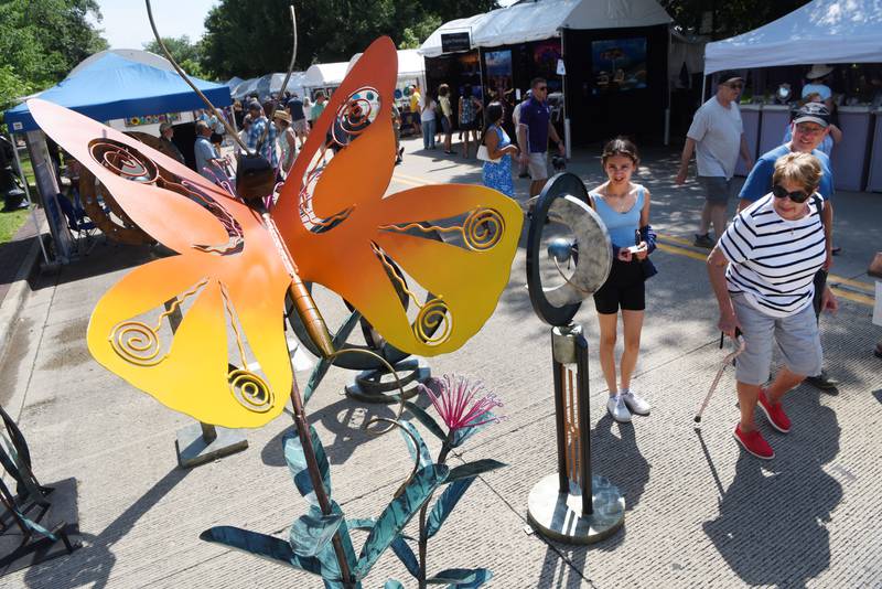 A butterfly sculpture made by artist Anthony Slichenmyer of Olney, Ill., is displayed during the Geneva Arts Fair on South Third St. in Geneva Saturday, July 23, 2022.