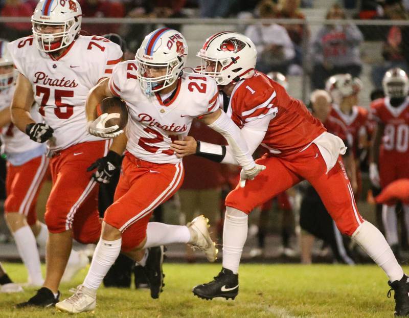 Ottawa's Jace Veith breaks free of Streator's Isaiah Weibel as his teammate Carter Price (76) blocks defenders on Friday, Sept. 6, 2024 at Doug Dieken Stadium.