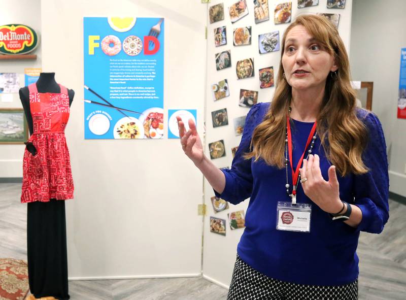 Michelle Donahoe, executive director of the DeKalb County History Center, talks Thursday, June 6, 2024, about the new exhibit “Food: Gathering Around the Table,” now open at the center in Sycamore. The exhibit was created by the DeKalb County History Center in collaboration with the Smithsonian Institution's Museum on Main Street program.