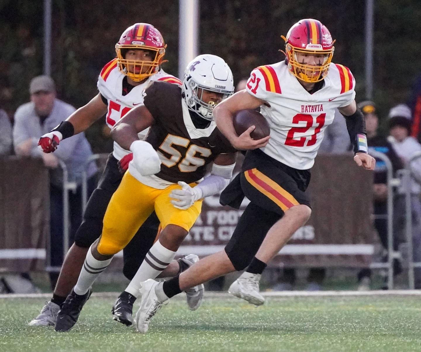 Batavia’s Ryan Boe (21) runs the ball on a keeper against Mt. Carmel during a class 7A semifinal football playoff game at Mt. Carmel High School in Chicago on Saturday, Nov 18, 2023.