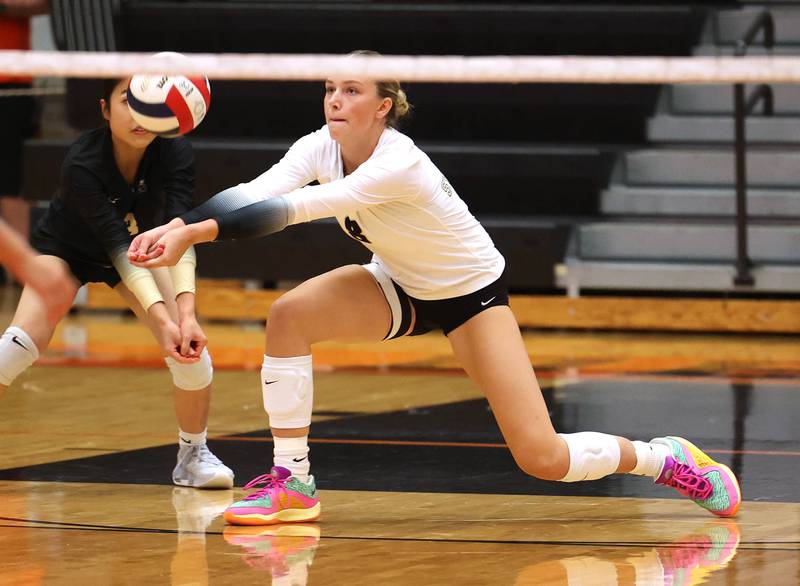 Sycamore's Ava Carpenter reaches for a ball during their match against DeKalb Wednesday, Aug. 28, 2024, at DeKalb High School.