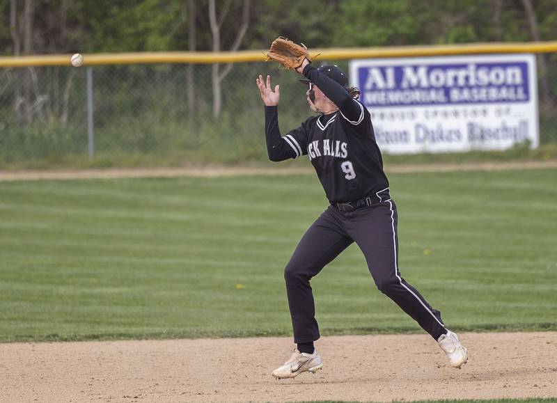 A bad hop skips over Rock Falls’ Colby Ward’s head against Dixon Monday, April 22, 2024 in Dixon.