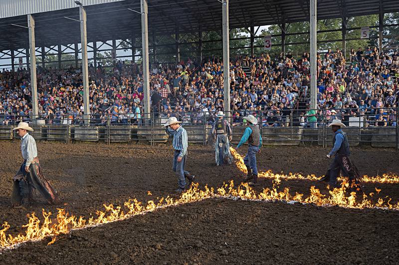 Bull riders enter the ring for the Rice Bull Riding and Barrel Racing event Thursday, August 11, 2023 at the Carroll County fair.